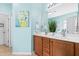 Stylish bathroom with dual vanities, framed mirrors, and bright natural light at 1400 Manley Ct, Fuquay Varina, NC 27526