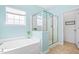 Inviting bathroom with a soaking tub and a clear glass enclosed shower at 1400 Manley Ct, Fuquay Varina, NC 27526