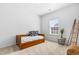 Cozy bedroom with a daybed, decoratives, and a window at 1400 Manley Ct, Fuquay Varina, NC 27526