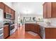 This kitchen features granite countertops, tiled backsplash, and stainless steel appliances at 1400 Manley Ct, Fuquay Varina, NC 27526