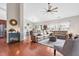 Spacious living room with hardwood floors, comfortable seating, and a ceiling fan at 1400 Manley Ct, Fuquay Varina, NC 27526