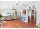 Open concept living space featuring hardwood floors and sightlines to the kitchen at 1400 Manley Ct, Fuquay Varina, NC 27526