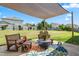 Cozy outdoor patio seating area with a shade covering and fenced yard at 1400 Manley Ct, Fuquay Varina, NC 27526