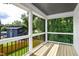 Outdoor living space on wood deck with a view of the private fenced backyard at 1410 Joe Louis Ave, Raleigh, NC 27610