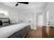 Bedroom with three closets, ceiling fan, and natural light from the window at 1410 Joe Louis Ave, Raleigh, NC 27610