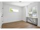 Bright bedroom featuring hardwood floors and a window with natural light at 1410 Joe Louis Ave, Raleigh, NC 27610