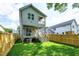 This backyard features a double deck, a privacy fence, and a large green lawn at 1410 Joe Louis Ave, Raleigh, NC 27610