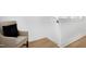 Cozy hallway corner with a comfortable chair and a black decorative pillow at 1410 Joe Louis Ave, Raleigh, NC 27610