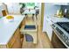 Modern kitchen with a custom pull-out trash can and stainless steel appliances at 1410 Joe Louis Ave, Raleigh, NC 27610