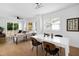 Open-concept living room with modern furnishings and natural light at 1410 Joe Louis Ave, Raleigh, NC 27610
