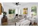 Comfortable living room with a ceiling fan, modern decor, and sliding glass doors to a patio at 1410 Joe Louis Ave, Raleigh, NC 27610