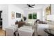 Comfortable living room with a ceiling fan, modern decor, and sliding glass doors to a patio at 1410 Joe Louis Ave, Raleigh, NC 27610