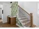 Modern staircase with leaf-patterned wallpaper at 1410 Joe Louis Ave, Raleigh, NC 27610