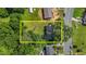 Aerial view showing the property's location, boundaries, and surrounding neighborhood with mature trees at 1442 Morningside Dr, Burlington, NC 27217