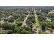 Aerial view highlighting the neighborhood with mature trees, winding roads, and surrounding landscape at 1442 Morningside Dr, Burlington, NC 27217
