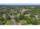 Aerial view of the neighborhood showcasing the community's mature trees, streets, and neighborhood homes at 1442 Morningside Dr, Burlington, NC 27217