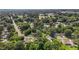 Aerial view of the neighborhood featuring mature trees, nearby roads, and overhead power lines at 1442 Morningside Dr, Burlington, NC 27217