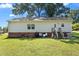 The backyard showcases a lawn, back entry and stairs at 1442 Morningside Dr, Burlington, NC 27217