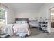 Carpeted bedroom featuring a window, plush comforter and furnishings at 1442 Morningside Dr, Burlington, NC 27217
