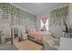 Bedroom with decorative vines, plush decor, area rug, pink bedding and natural light at 1442 Morningside Dr, Burlington, NC 27217