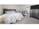 Bedroom featuring carpet, neutral walls, crib and view into the en-suite bathroom at 1442 Morningside Dr, Burlington, NC 27217