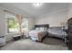 Carpeted bedroom featuring a window, plush comforter and furnishings at 1442 Morningside Dr, Burlington, NC 27217