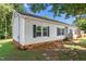 Vinyl-sided home featuring dark shutters, well-maintained siding, and a neatly kept lawn and walkways at 1442 Morningside Dr, Burlington, NC 27217