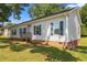 Inviting single-story home with a small front porch, vinyl siding, and lush green lawn at 1442 Morningside Dr, Burlington, NC 27217