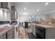 The kitchen features a stainless steel range hood, gray cabinetry and countertops at 1442 Morningside Dr, Burlington, NC 27217