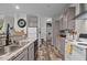 The kitchen features gray countertops, cabinets, and stainless steel appliances at 1442 Morningside Dr, Burlington, NC 27217