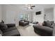Cozy living room featuring carpeting, with multiple sofas and lots of natural light at 1442 Morningside Dr, Burlington, NC 27217