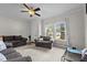 Comfortable living room featuring neutral carpeting, natural light, and modern furnishings at 1442 Morningside Dr, Burlington, NC 27217
