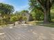 Wooden deck in fenced yard, with a shade tree and view of the house at 1521 N Duke St, Durham, NC 27701