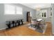 Bright dining room with hardwood floors, modern furnishings, and large windows at 1521 N Duke St, Durham, NC 27701
