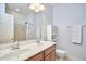 Bathroom vanity featuring double sinks and a white cabinet at 1601 Bellenden Dr, Durham, NC 27713