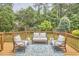 Relaxing outdoor deck area with stylish seating and lush greenery at 1601 Bellenden Dr, Durham, NC 27713