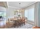 Dining room features a modern chandelier, wood floors, and is decorated in neutral colors at 1601 Bellenden Dr, Durham, NC 27713