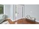 Bright foyer with hardwood floors, natural light, and stylish bench at 1601 Bellenden Dr, Durham, NC 27713