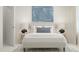 Stylish bedroom showcasing a large blue painting, lamps, and a cozy bed with soft lighting at 164 Paramount Dr, Smithfield, NC 27577