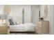 Bright bedroom featuring neutral tones, a woven wall hanging, and a light wood dresser at 164 Paramount Dr, Smithfield, NC 27577
