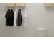 Organized closet featuring hanging shirts, wire shelving, and decorative basket at 164 Paramount Dr, Smithfield, NC 27577