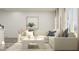 Bright, open living space with a sectional couch and plenty of natural light at 164 Paramount Dr, Smithfield, NC 27577