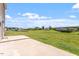 Scenic backyard with a concrete patio and expansive views of the green landscape at 167 Young Farm Dr, Lillington, NC 27546