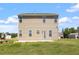 Home featuring backyard views and back door at 167 Young Farm Dr, Lillington, NC 27546