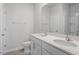 Bright bathroom featuring double sinks with quartz countertops and modern fixtures at 167 Young Farm Dr, Lillington, NC 27546