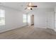 Bedroom with neutral walls, carpet floors, and access to the bathroom at 167 Young Farm Dr, Lillington, NC 27546