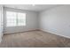 Bedroom with neutral walls, carpet floors, and a bright window view at 167 Young Farm Dr, Lillington, NC 27546