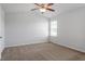 Bedroom with a ceiling fan, neutral walls, and a bright window view at 167 Young Farm Dr, Lillington, NC 27546