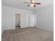 Spacious bedroom features a ceiling fan, neutral walls, and closet with double doors at 167 Young Farm Dr, Lillington, NC 27546