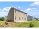 Two-story home with a well-maintained lawn and a back patio, perfect for outdoor living at 167 Young Farm Dr, Lillington, NC 27546